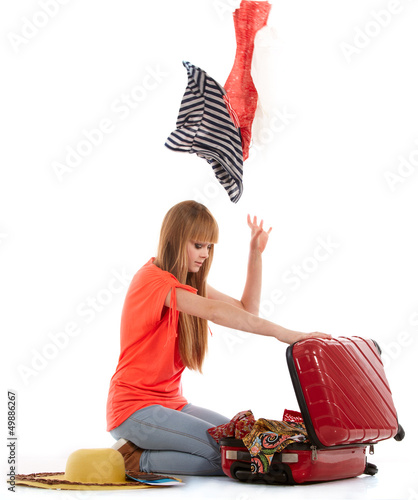 Photo: young girl with suitcase on white young girl with suitcase on white