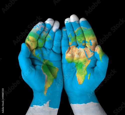 Photo: Map painted on hands.Concept of having the world in our hands Map painted on hands.Concept of having the world in our hands