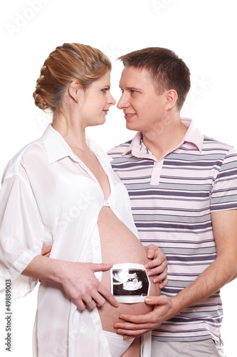 Photo: Happy pregnant family with ultrasound picture Happy pregnant family with ultrasound picture