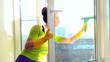 Women cleaning a window