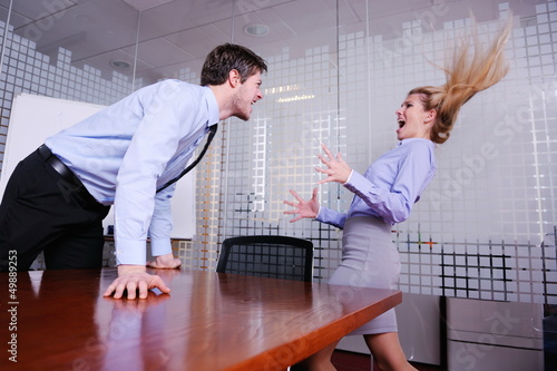 Photo: Angry busines sman screaming at employee Angry busines sman screaming at employee