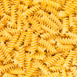 Italian Fusilli, Rotini or Scroodle Macaroni Pasta background