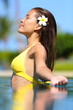 Spa woman enjoying meditating in water