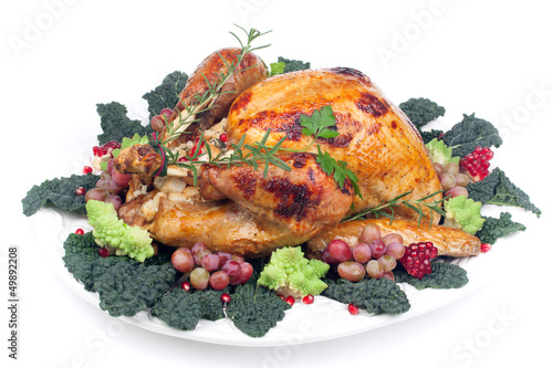 Photo: Garnished roasted turkey on white Garnished roasted turkey on white
