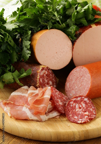 Photo: Assorted variety of sausages on a cutting board Assorted variety of sausages on a cutting board