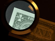 Foto: dollar and magnifier dollar and magnifier