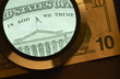 Foto: dollar and magnifier dollar and magnifier