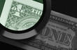 Foto: dollar and magnifier dollar and magnifier