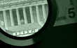 Foto: dollar and magnifier dollar and magnifier