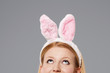 Easter bunny woman looking up