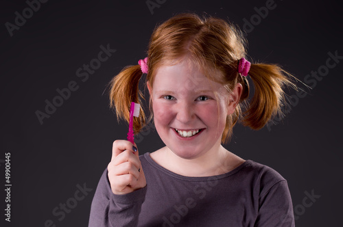 Photo: Pretty smiling Girl with Toothbrush Pretty smiling Girl with Toothbrush