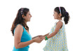 indian mother and daugther staring at each other