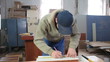 Furniture maker at work in workshop