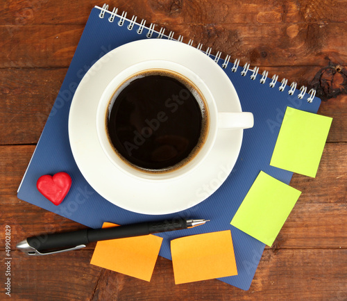 Photo: Cup of coffee on worktable close up Cup of coffee on worktable close up