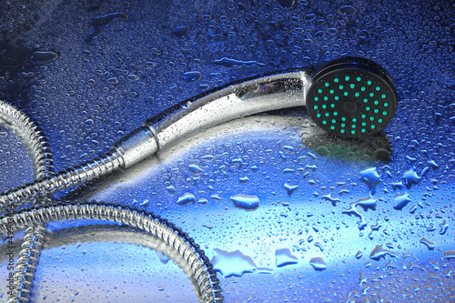 Photo: Shower and drops, on blue background Shower and drops, on blue background