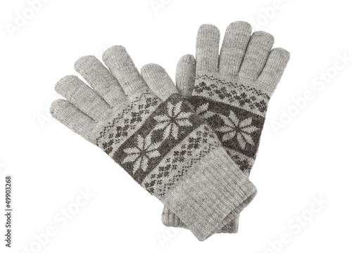 Photo: A pair of knitted winter gloves isolated on white background A pair of knitted winter gloves isolated on white background