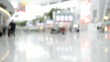 blurred commuters at an airport