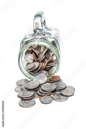 Photo: Coins Spilling Out Of Glass Mug Coins Spilling Out Of Glass Mug
