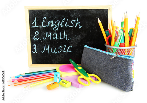 Photo: pencil box with school equipment and timetable isolated on pencil box with school equipment and timetable isolated on
