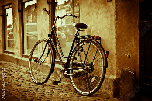 Photo: Classic vintage retro city bicycle in Copenhagen, Denmark Classic vintage retro city bicycle in Copenhagen, Denmark