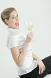 portrait of young woman with a glass of white wine