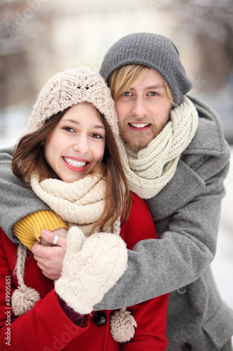 Photo: Couple in Winter Clothing Embracing Couple in Winter Clothing Embracing
