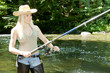 woman fishing in river