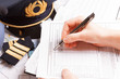 Airplane pilot filling in flight plan