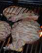 steaks on grill