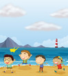 Four boys playing at the beach