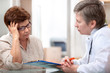 Female patient tells the doctor about her health complaints