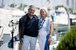 Mature couple enjoying a stroll at a marina