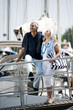 Mature couple enjoying a stroll at a marina