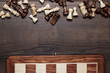 chess board and figures on woden background