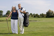 Mature couple on golf course