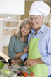 Mature couple preparing food