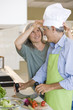 Mature couple preparing food