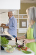 Mature couple preparing food