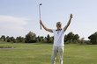 Mature man playing golf