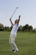 Mature man playing golf