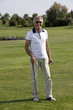 Mature man playing golf