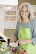 Mature woman preparing food