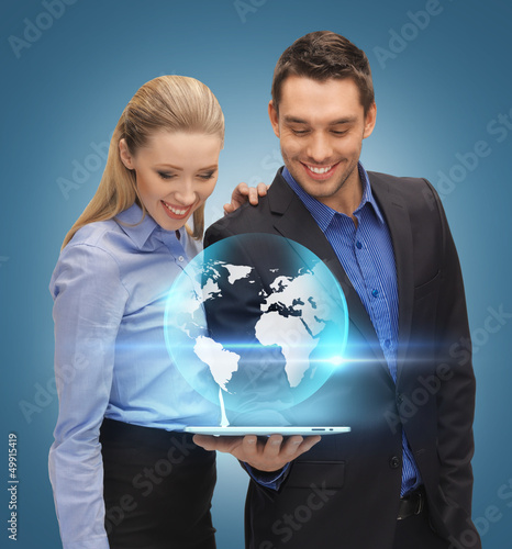 Photo: man and woman with tablet pc man and woman with tablet pc