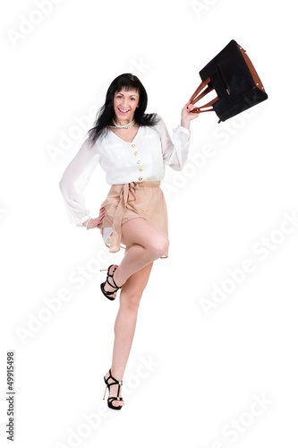 Photo: Happy shopping woman jumping with bag Happy shopping woman jumping with bag