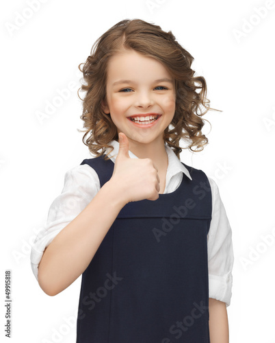Photo: pre-teen girl showing thumbs up pre-teen girl showing thumbs up