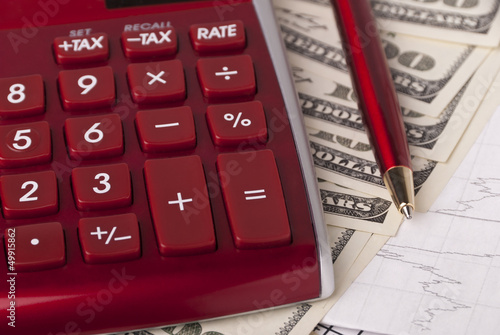 Photo: Money, pen and calculator Money, pen and calculator