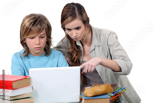 Photo: Two kids studying together Two kids studying together