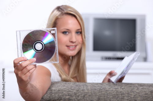 Photo: Girl listening to CDs Girl listening to CDs
