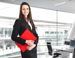 Smiling businesswoman in her office