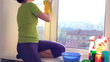 Women cleaning a window